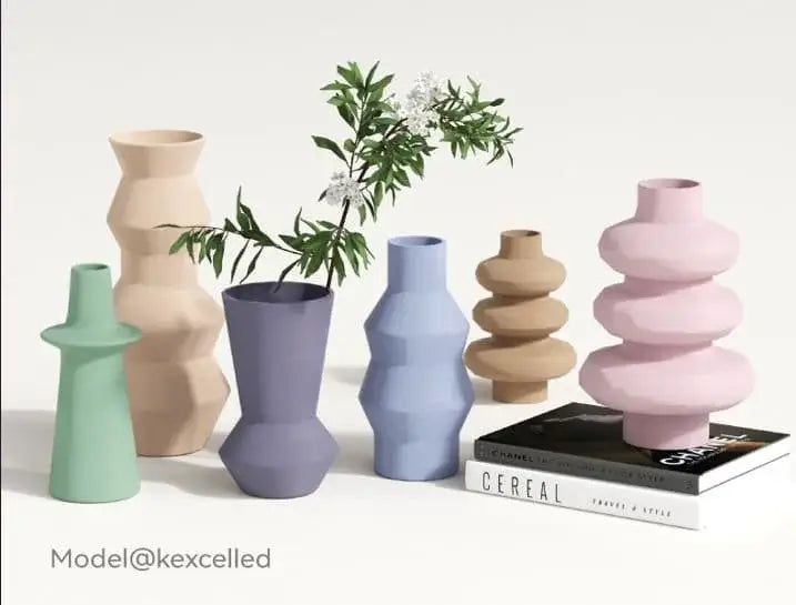 Kexcelled THE K5 PETG M – Mattes PETG-Filament displayed in decorative vases with varying colors and designs.