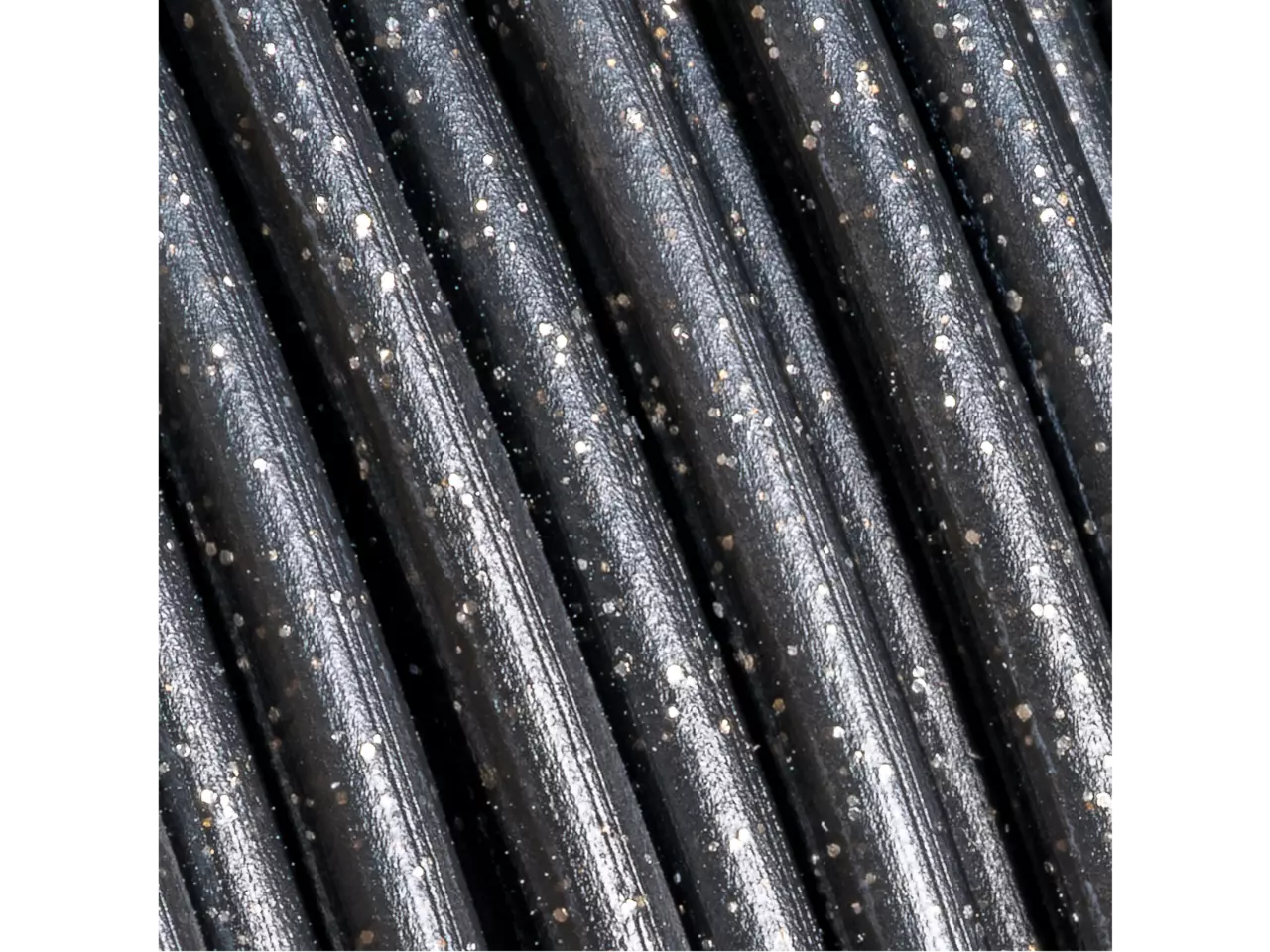 Polymaker Panchroma PLA Galaxy Filament in black with sparkling silver aluminum particles for a cosmic effect.