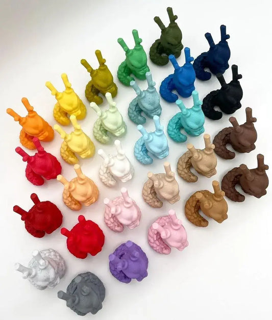 Polymaker Panchroma™ PLA Matt color samples displayed in 3D printed snail models, showcasing a variety of vibrant hues.